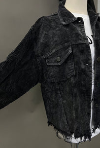 Mannequin is wearing a black distressed corduroy shacket. 