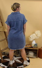 Load image into Gallery viewer, Denim button down dress with western inspired backdrop. This image shows the back of the denim dress
