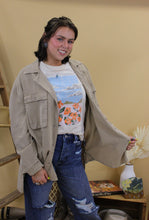Load image into Gallery viewer, Model is wearing the Montana jacket in size small with the jade graphic tee and dark denim jeans. She is standing in front of a wester inspired back drop
