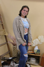 Load image into Gallery viewer, Model is wearing the Montana jacket in size small with the jade graphic tee and dark denim jeans. She is standing in front of a wester inspired back drop
