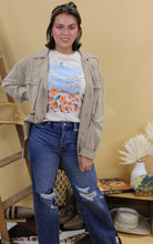 Load image into Gallery viewer, Model is wearing the Montana jacket in size small with the jade graphic tee and dark denim jeans. She is standing in front of a wester inspired back drop
