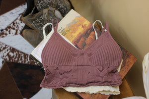 This image shows the Viola bralette in two available colors, Mauve and Cream. 
