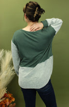 Load image into Gallery viewer, Model is wearing a green and grey colorblock long sleeve top 
