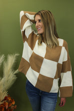 Load image into Gallery viewer, Model is wearing an oversized checkered sweater. 
