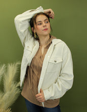 Load image into Gallery viewer, Model is wearing a cream color corduroy jacket. 
