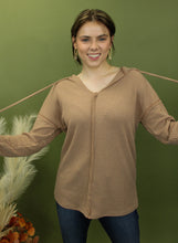 Load image into Gallery viewer, Model is wearing a camel waffle knit hoodie.
