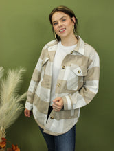 Load image into Gallery viewer, Model is wearing a khaki plaid jacket. 
