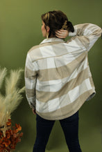 Load image into Gallery viewer, Model is wearing a khaki plaid jacket. 
