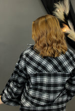 Load image into Gallery viewer, Model is wearing a black and white plaid shacket.

