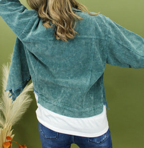 Model is wearing a hunter green color corduroy jacket. 