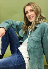 Load image into Gallery viewer, Model is wearing a hunter green color corduroy jacket. 
