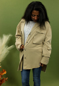 Model is wearing a taupe oversized shacket