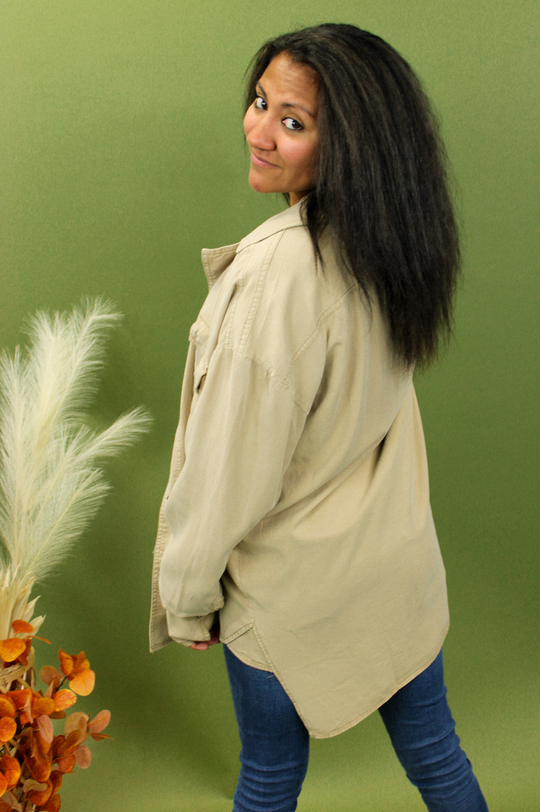 Model is wearing a taupe oversized shacket
