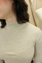 Load image into Gallery viewer, Model is wearing a slightly cropped neutral color sweater with a hint of sparkles. 
