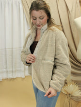 Load image into Gallery viewer, Model is wearing a neutral color sherpa jacket in front of a neutral backdrop. 
