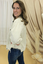 Load image into Gallery viewer, Model is wearing a cream color corduroy jacket.
