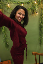 Load image into Gallery viewer, Model is wearing a burgundy sweater and sweater skirt set. 
