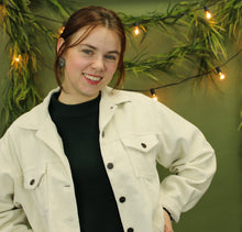 Load image into Gallery viewer, Model is wearing a cream corduroy jacket. 
