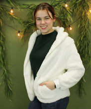 Load image into Gallery viewer, Model is wearing a white cozy cardigan. 
