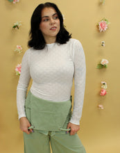 Load image into Gallery viewer, Model is wearing a white long sleeve lace tee. 
