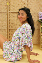 Load image into Gallery viewer, Models are wearing a floral romper. 
