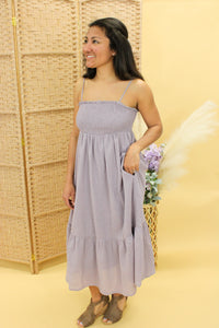 Models are wearing a lilac color midi dress.