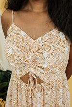 Load image into Gallery viewer, Model is wearing an orange and cream paisley print dress
