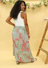 Load image into Gallery viewer, Model is wearing a patchwork print skirt.
