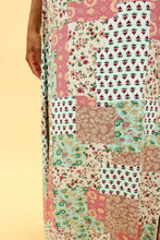 Load image into Gallery viewer, Model is wearing a patchwork print skirt.
