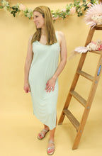 Load image into Gallery viewer, Model is wearing a mint color midi dress. 
