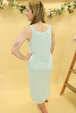 Load image into Gallery viewer, Model is wearing a mint color midi dress. 
