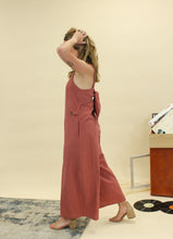 Load image into Gallery viewer, Models are wearing a brick colored jumpsuit. 
