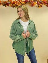 Load image into Gallery viewer, Model is wearing a green shacket. 
