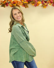 Load image into Gallery viewer, Model is wearing a green shacket. 
