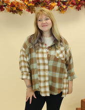 Load image into Gallery viewer, Model is wearing an oversized plaid shirt. 
