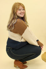 Load image into Gallery viewer, Model is wearing a color block sweater. 
