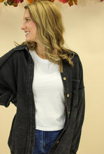 Load image into Gallery viewer, Model is wearing a black shacket. 
