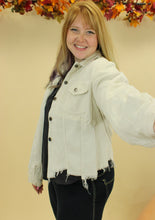 Load image into Gallery viewer, Model is wearing a cream color corduroy jacket. 
