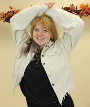 Load image into Gallery viewer, Model is wearing a cream color corduroy jacket. 
