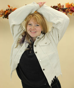 Model is wearing a cream color corduroy jacket. 