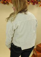 Load image into Gallery viewer, Model is wearing a cream color corduroy jacket. 
